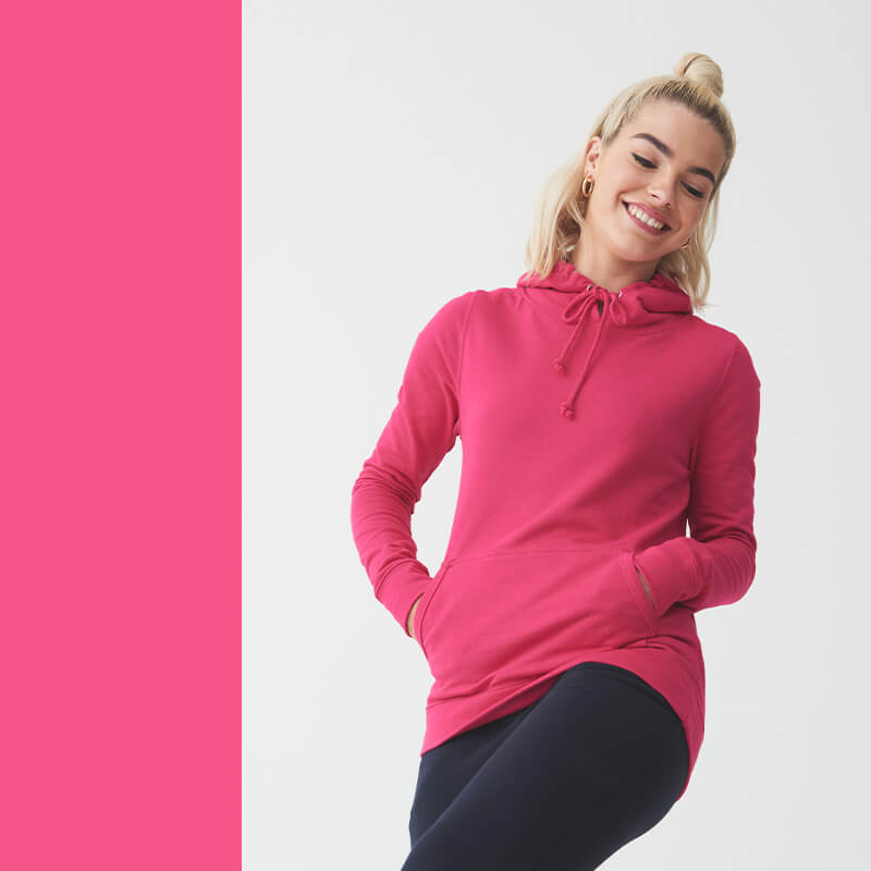 hot pink hoodie being modelled by a happy woman